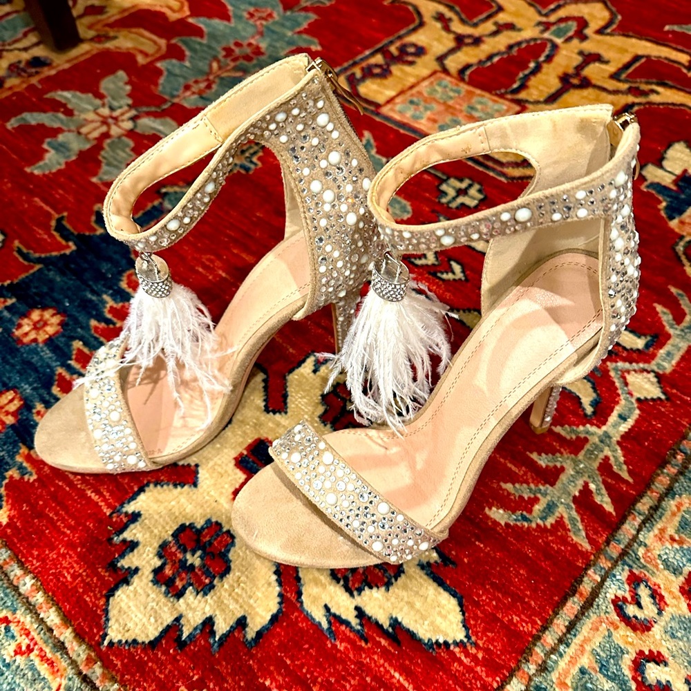 Sexy sparkly heel with Ostrich feather detail. Worn once. Size 8